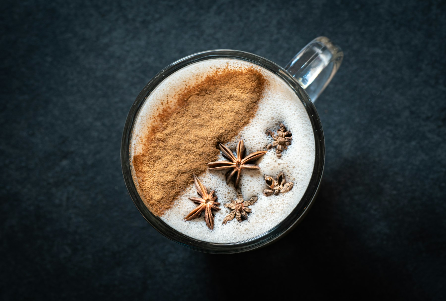 Chai latte with cinnamon and star anise from above