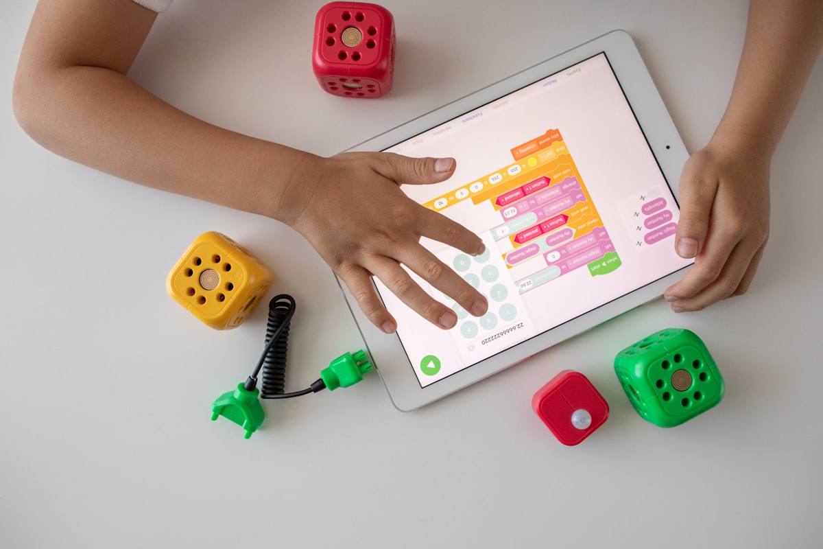 Child building block code on a tablet