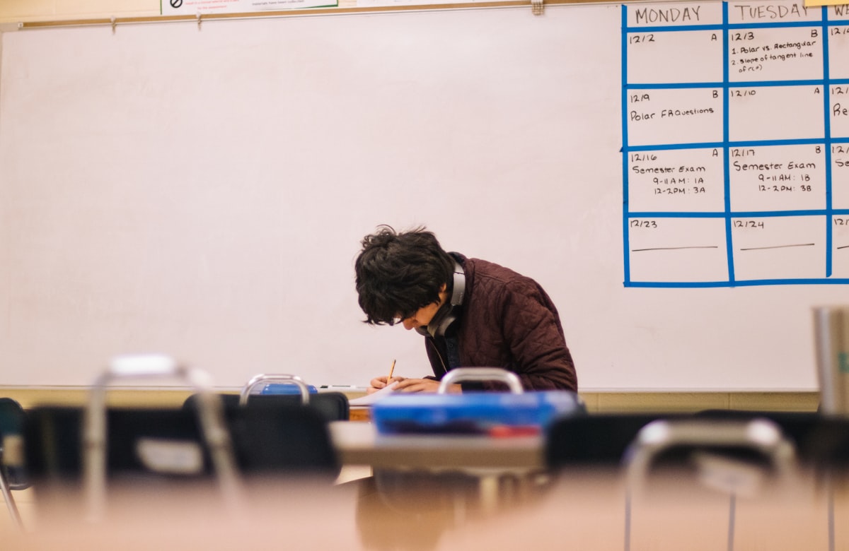 Student working through flashcards at a desk