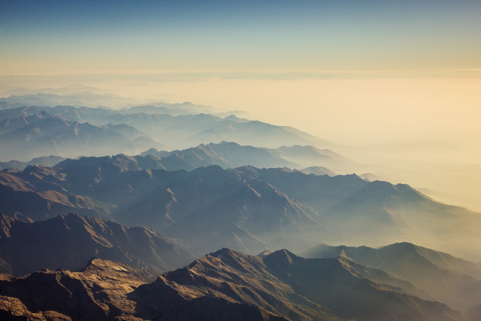 Hazy alpine mountain ridges