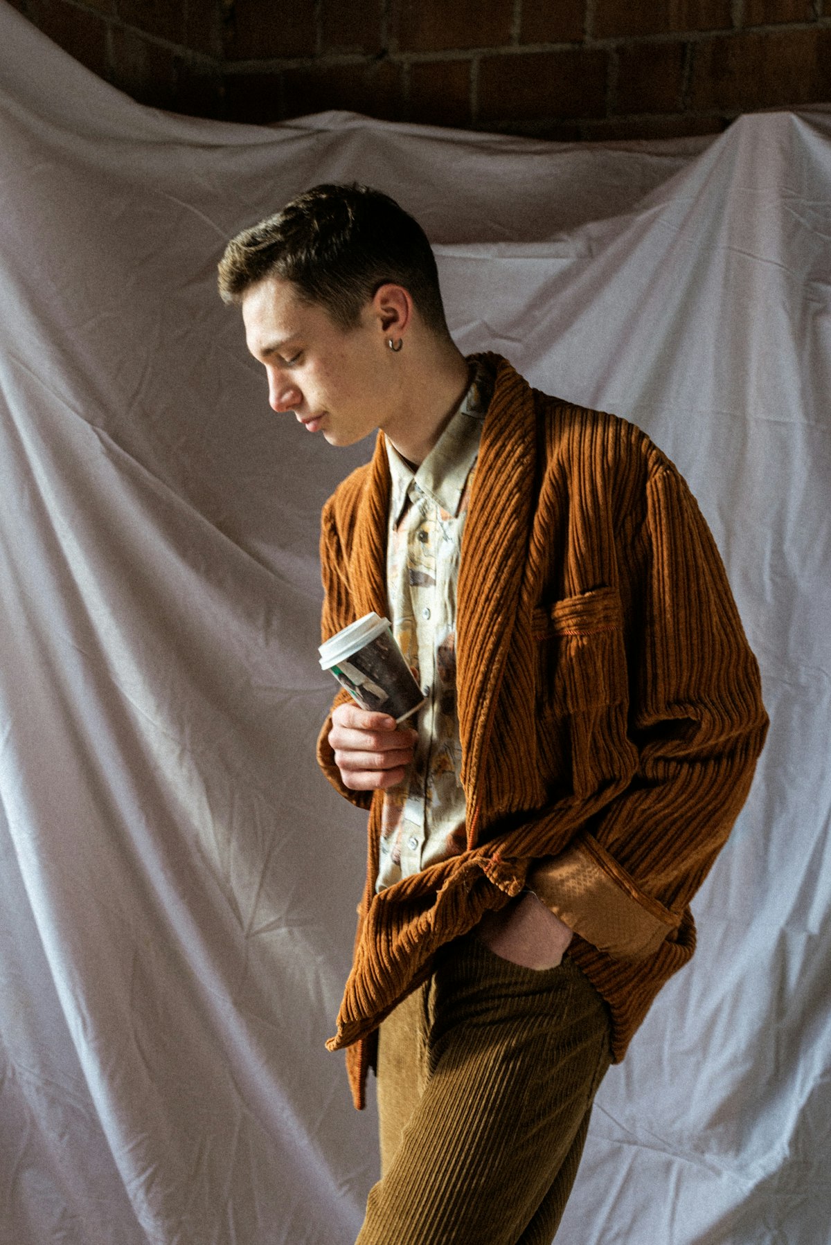 Rust corduroy jacket styled with a patterned shirt