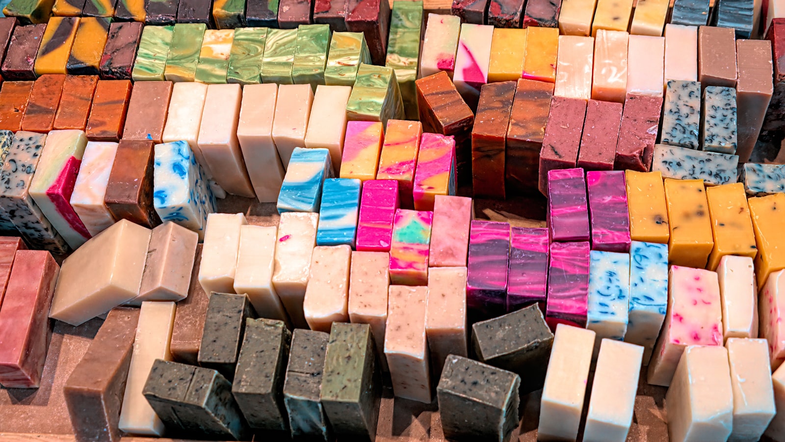 Rows of colorful handmade soap bars