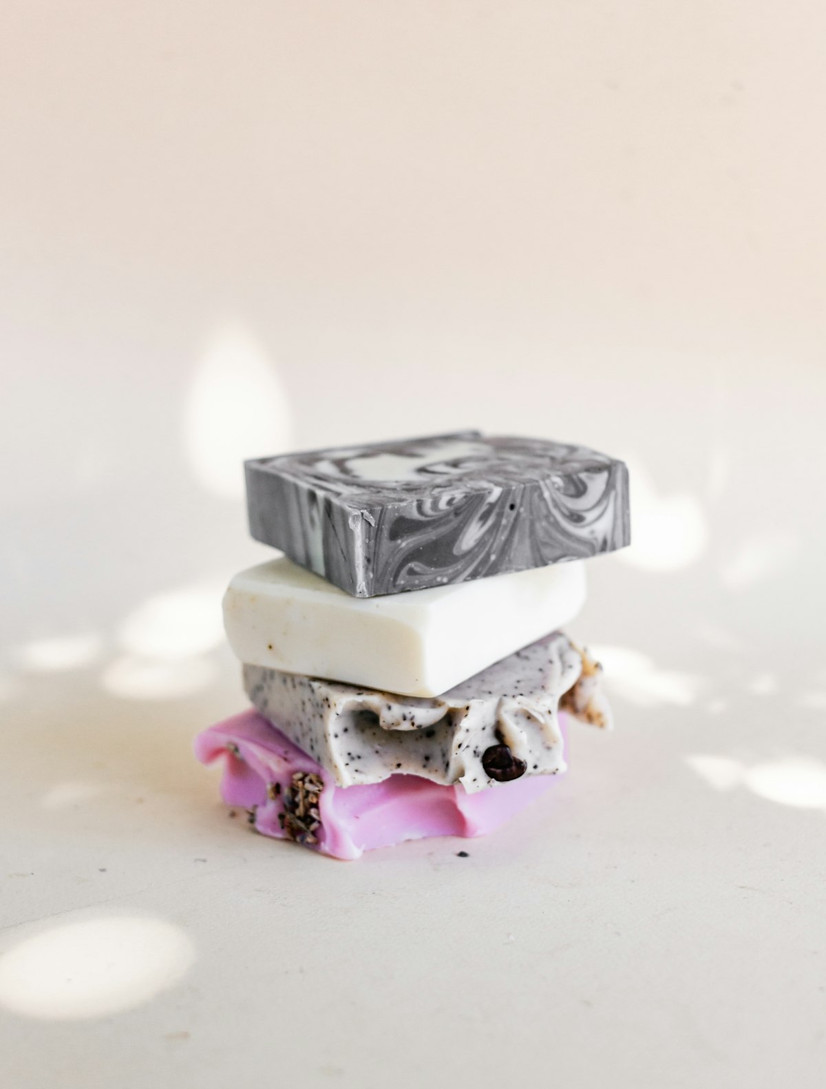 Stacked artisan soaps with charcoal swirl