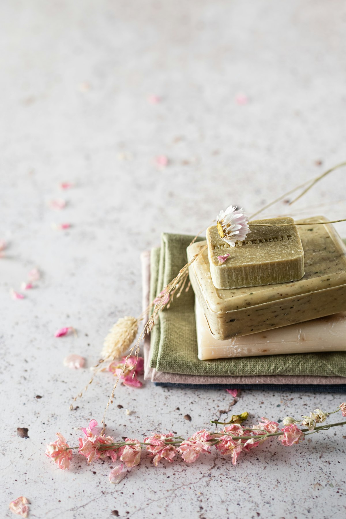 Green herbal soap stack with dried flowers