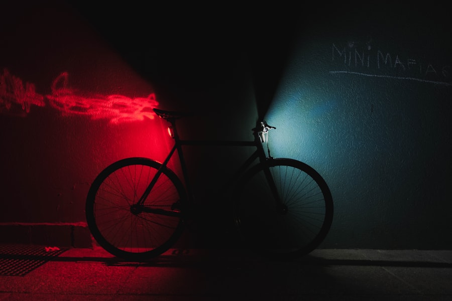 Front and rear bike lights glowing against a dark wall