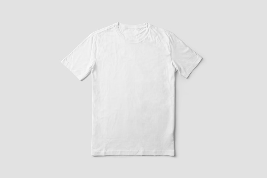A plain tee shirt laid flat on a plain background