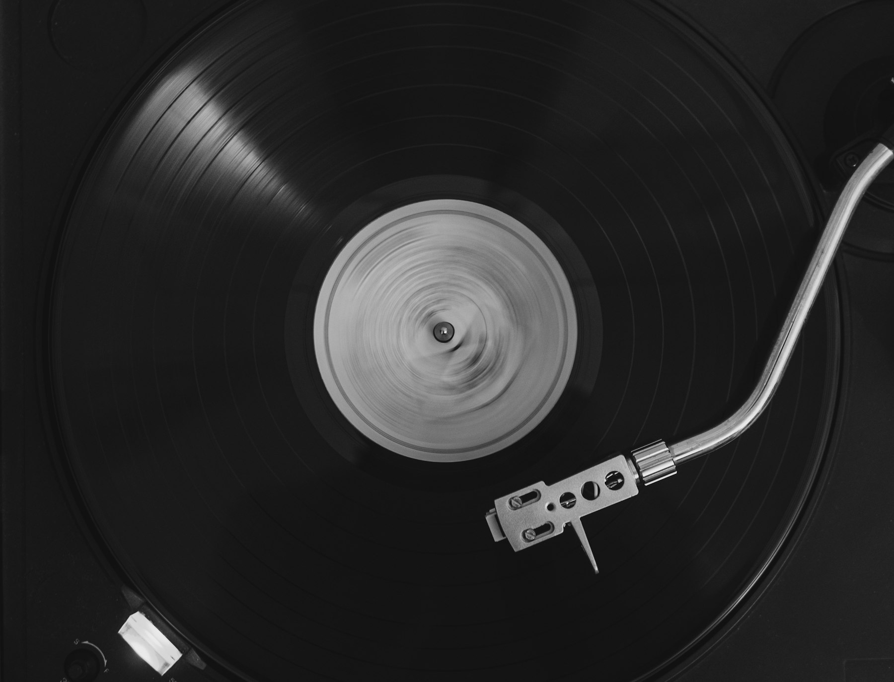 A record spinning on a turntable in low light