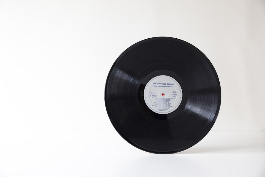 A black record standing against a plain background
